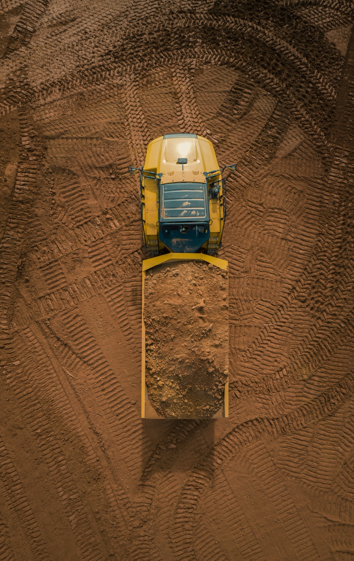 Top-down view of dozer pushing dirt